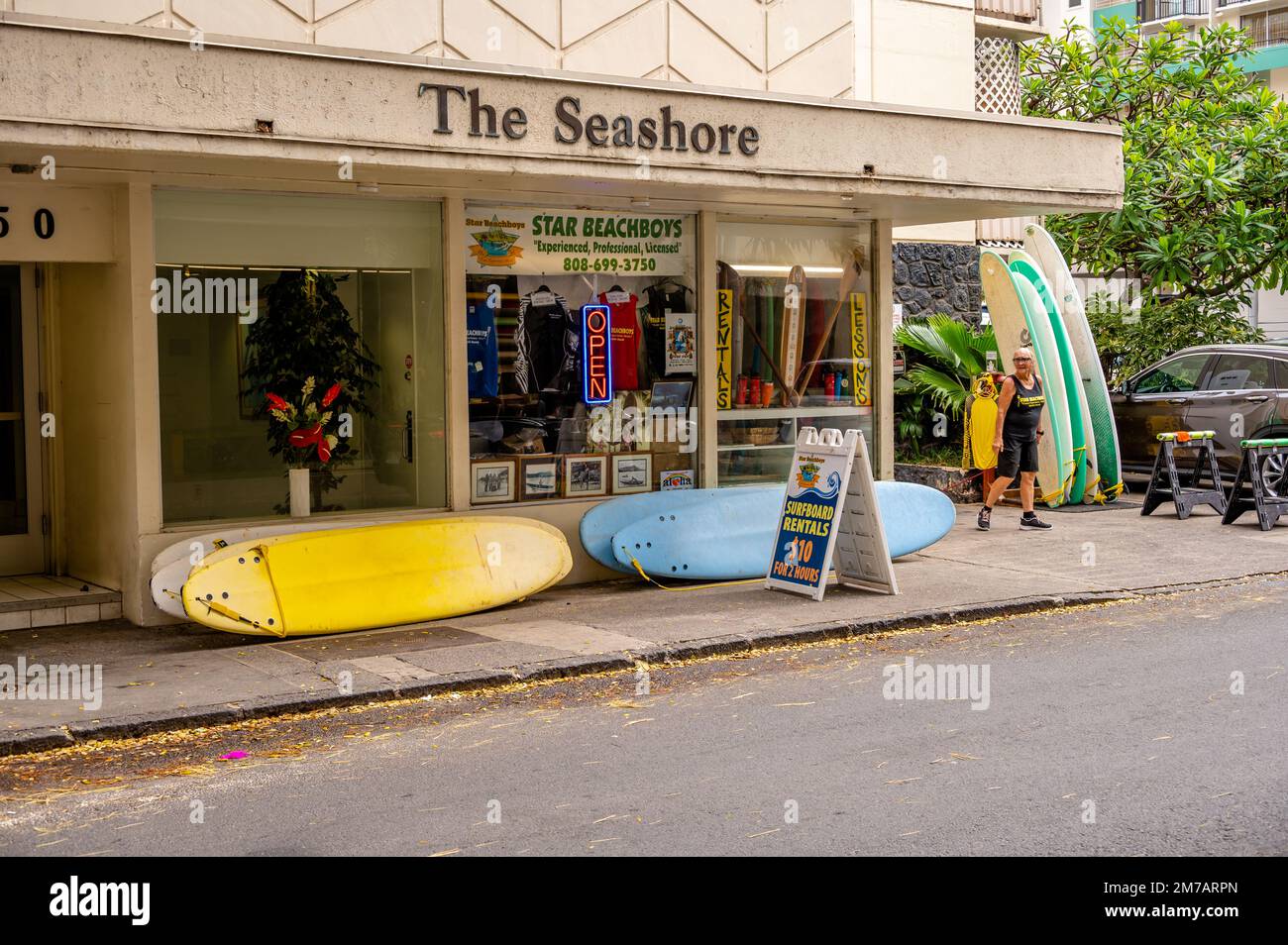 Honolulu, Hawaii January 1, 2023 Surfboards lined up for rent in