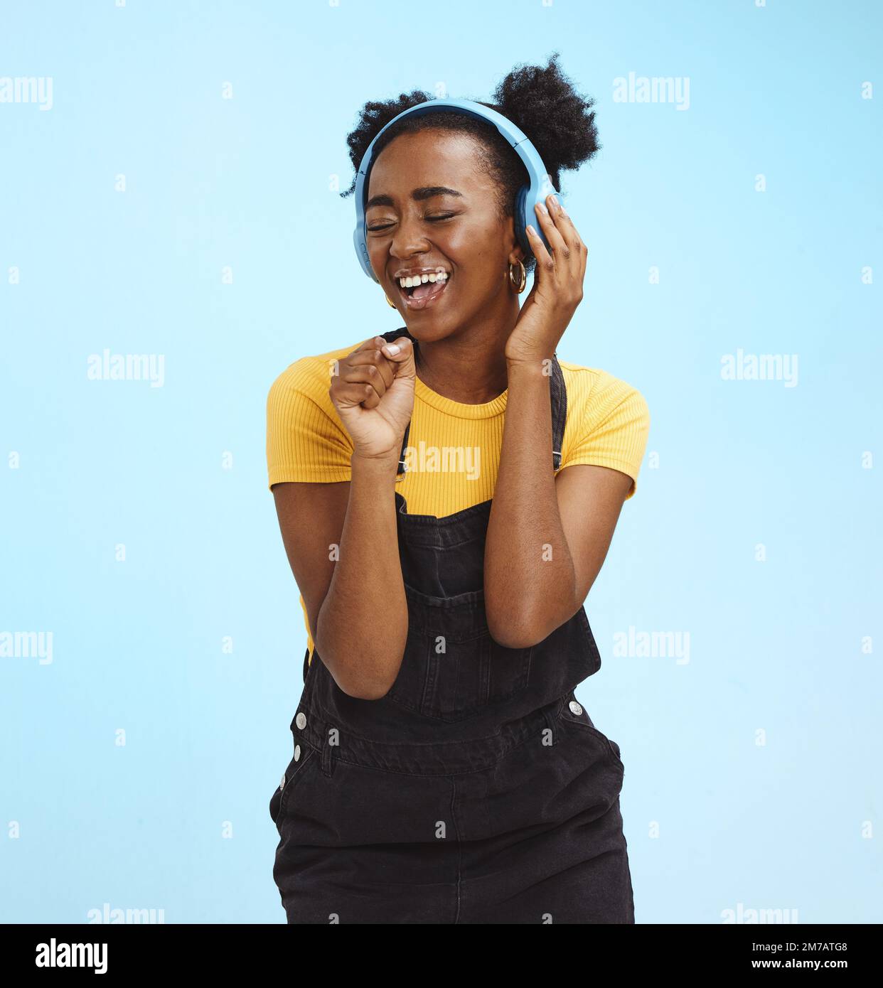 Music, dance and freedom with black woman and headphones, singing for relax, celebration and streaming. Audio, smile and technology with girl Stock Photo