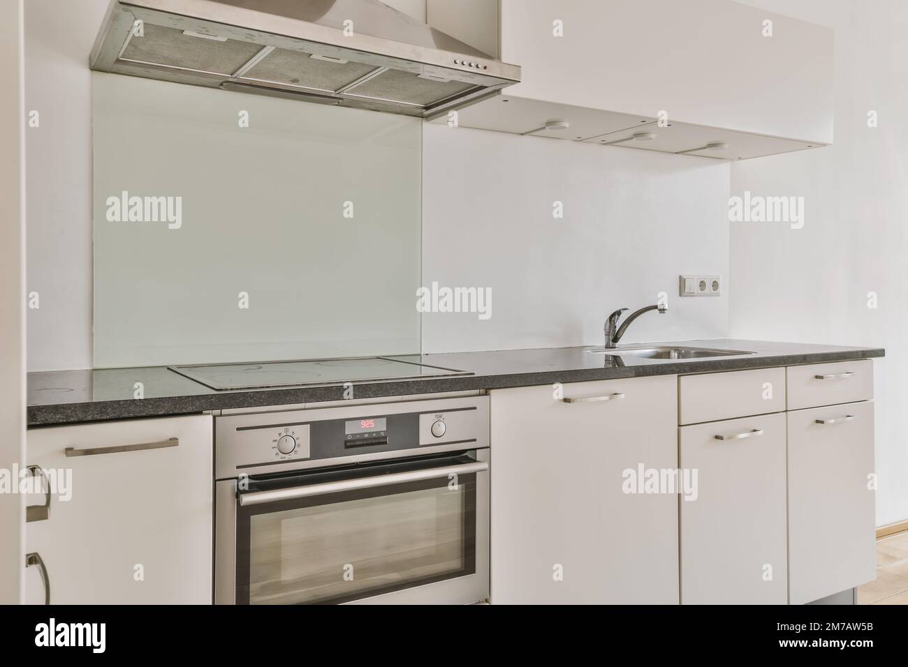 A luxurious white and blue kitchen with gold hardware, Bosch and Samsung  stainless steel appliances, and white marbled granite counter tops Stock  Photo - Alamy