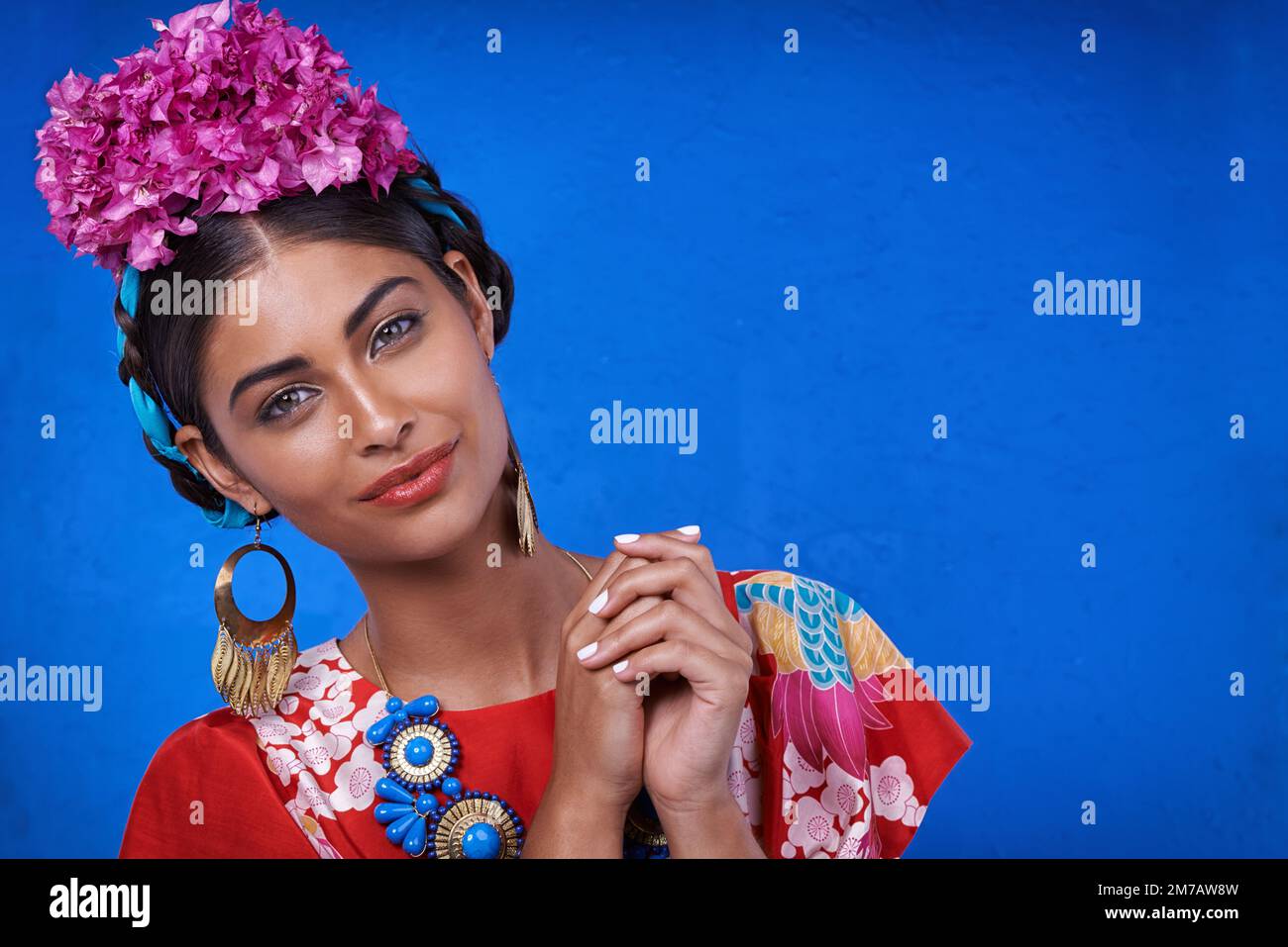 Colorful culture. A beautiful young woman wearing traditional cultural attire. Stock Photo