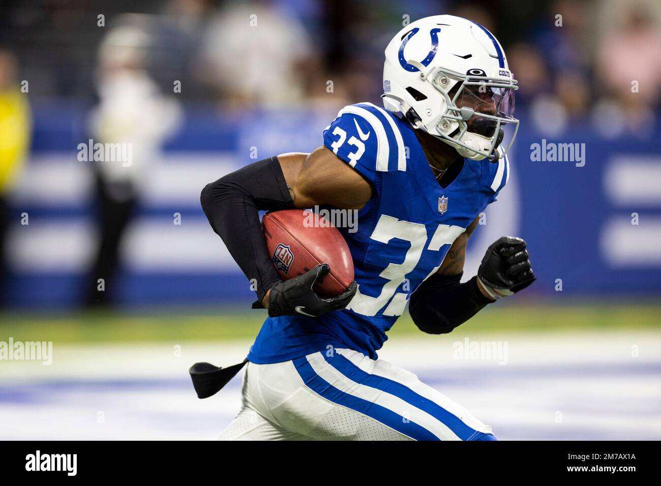 Indianapolis Colts cornerback Dallis Flowers (33) returns a kick as  Philadelphia Eagles tight end Brady Russell (83) defends during the first  quarter of an NFL pre-season football game, Thursday, Aug. 24, 2023,