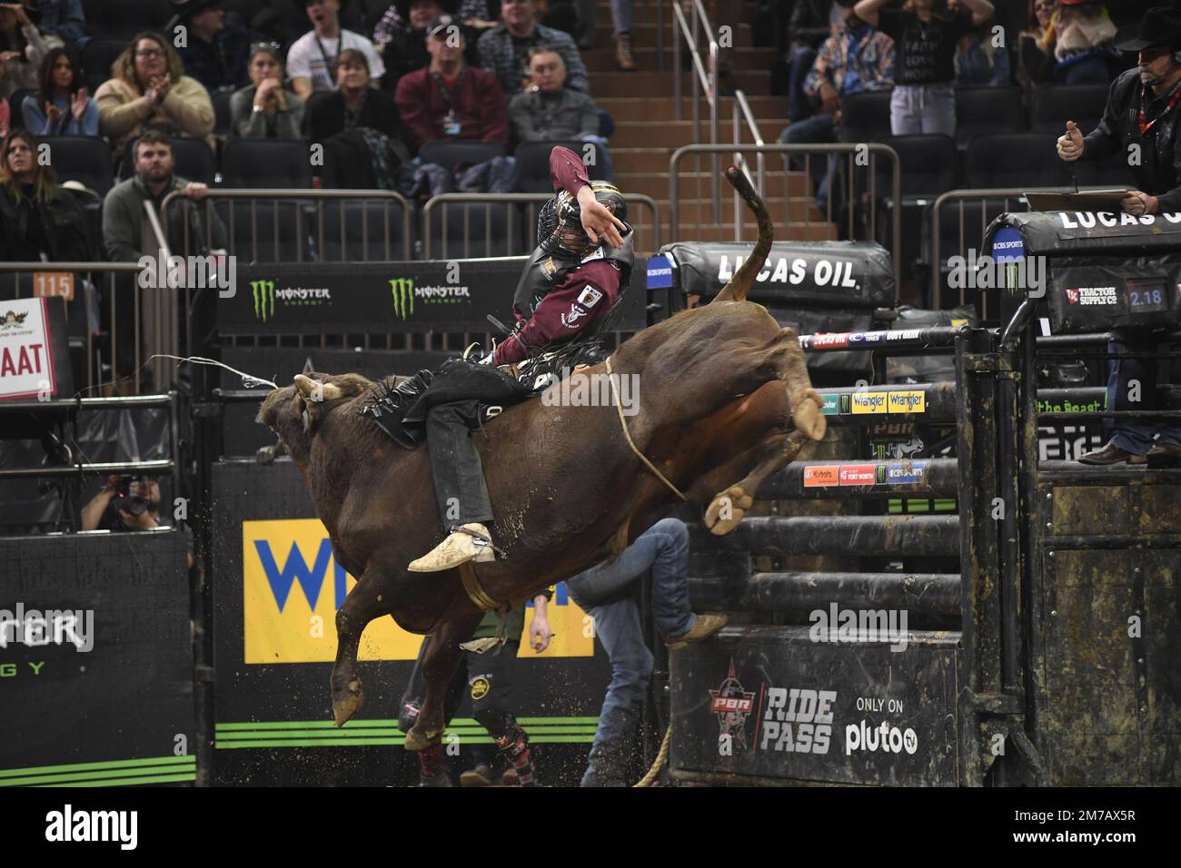 Professional Bull Rider rides Daniel Keeping bull Outlaw during PBR