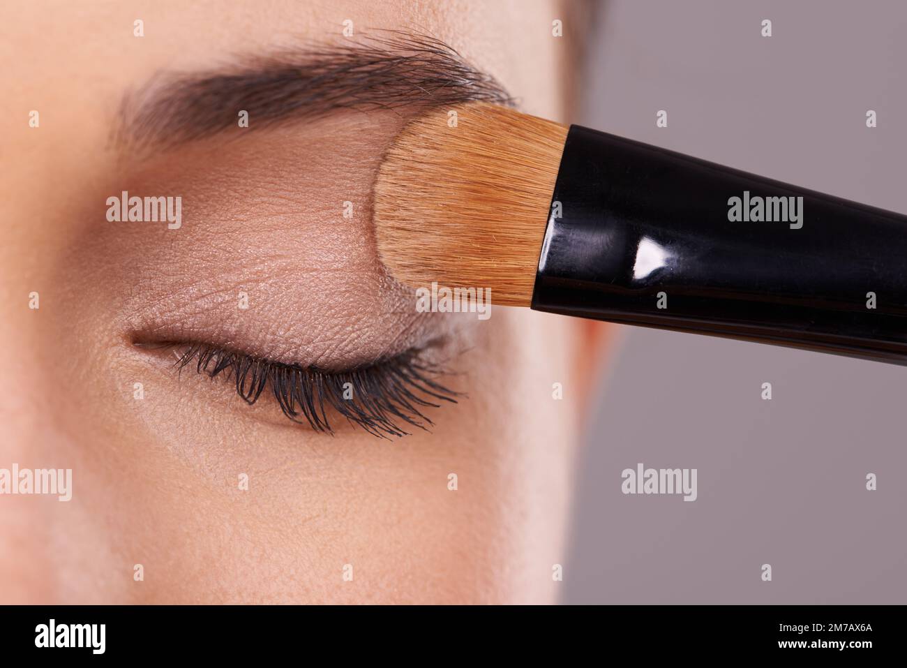 Flattering her eyes. Closeup shot of a woman applying eye shadow. Stock Photo