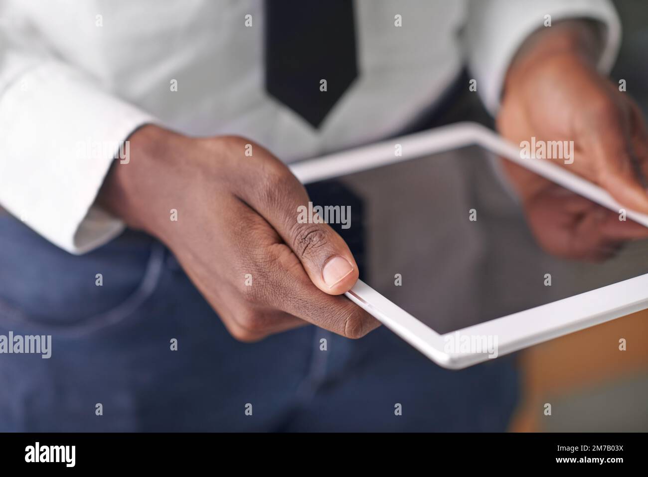 Technology takes you to the top. a man holding his digital tablet. Stock Photo