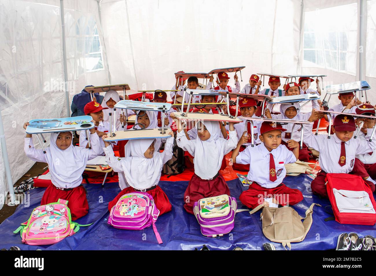 Cianjur, West Java, Indonesia. 9th Jan, 2023. Students attend in makeshift tent classroom during first day of school in Cianjur. A total of 262 students at SDN Citamiang Cianjur studied in makeshift tents due to their schools was damaged by the M 5.6 earthquake. (Credit Image: © Algi Febri Sugita/ZUMA Press Wire) Credit: ZUMA Press, Inc./Alamy Live News Stock Photo
