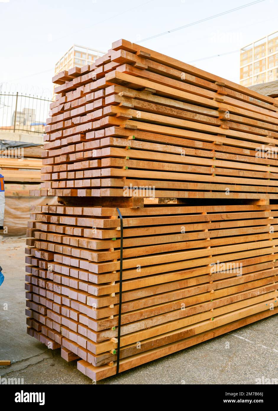 Stacked timber. Timbers ready for sale on the timber site. Withstanding ...