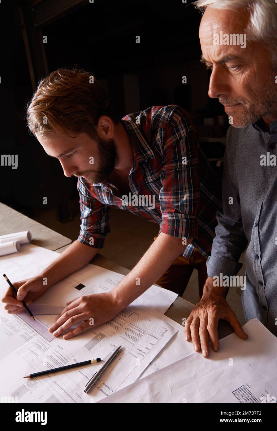 Turning his vision into reality. An architect drawing up plans Stock