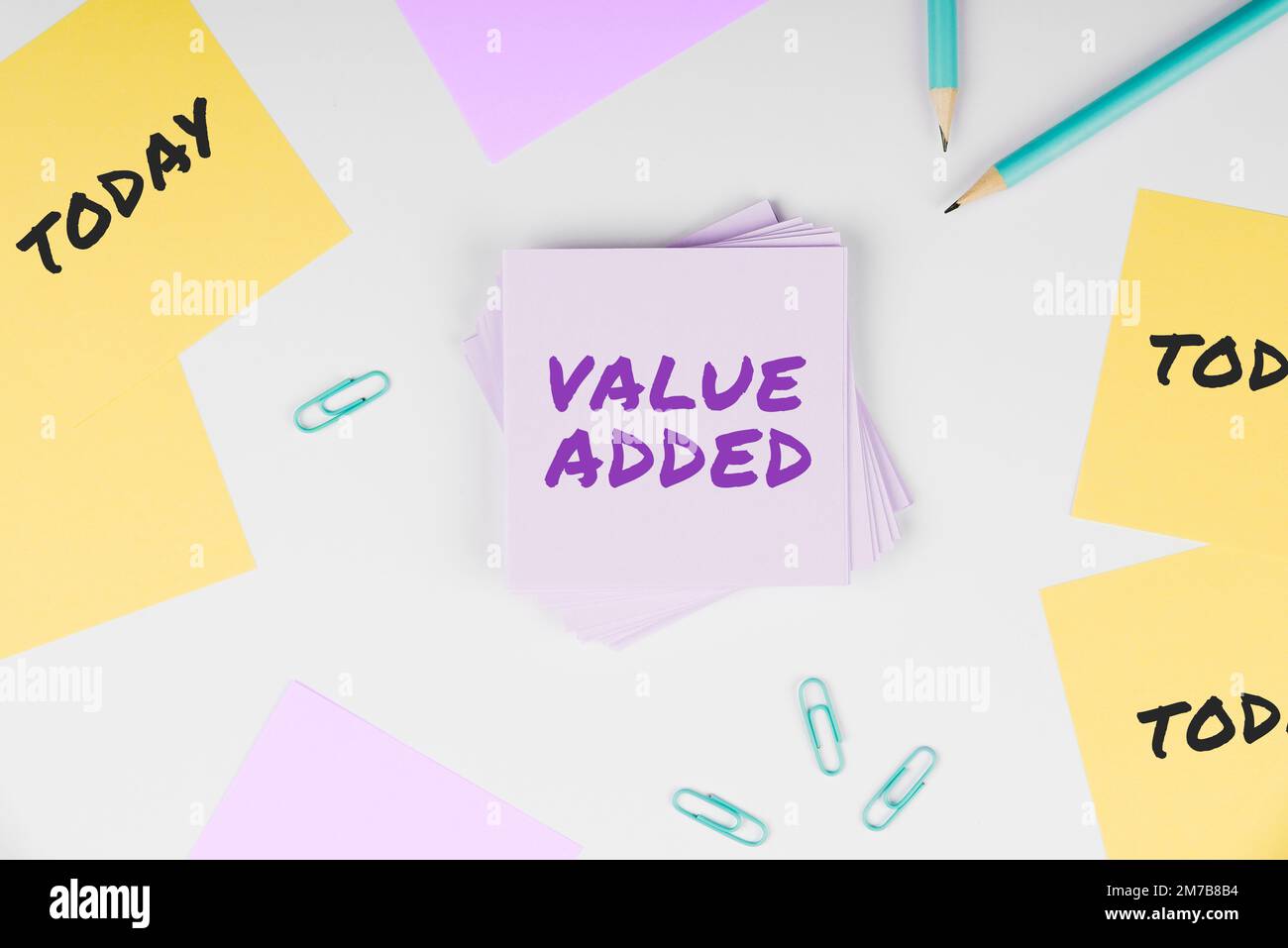 Hand writing sign Value Added. Business concept the extra value created ...