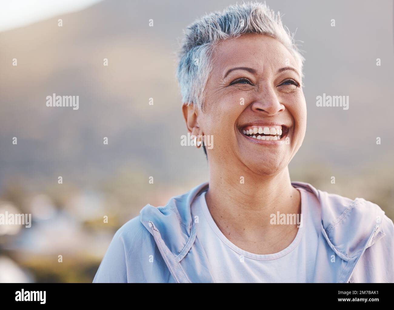 Face, elderly woman and smile with fitness outdoor, happy with cardio exercise, runner and happy in retirement. Health, wellness and active lifestyle Stock Photo