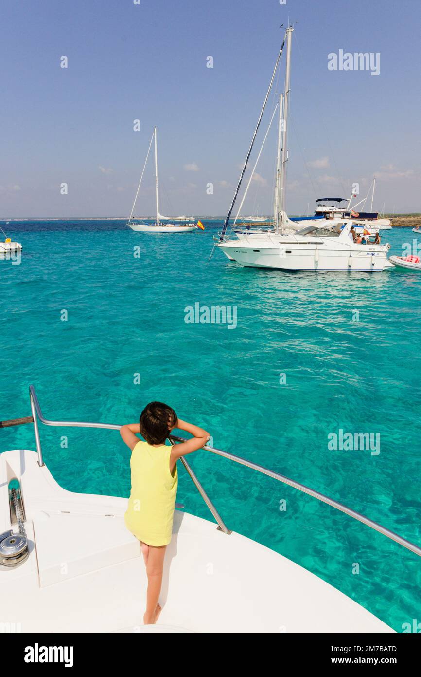 child watching in recreational boats, Es Trenc. Mallorca. Balearic Islands. Spain. Stock Photo