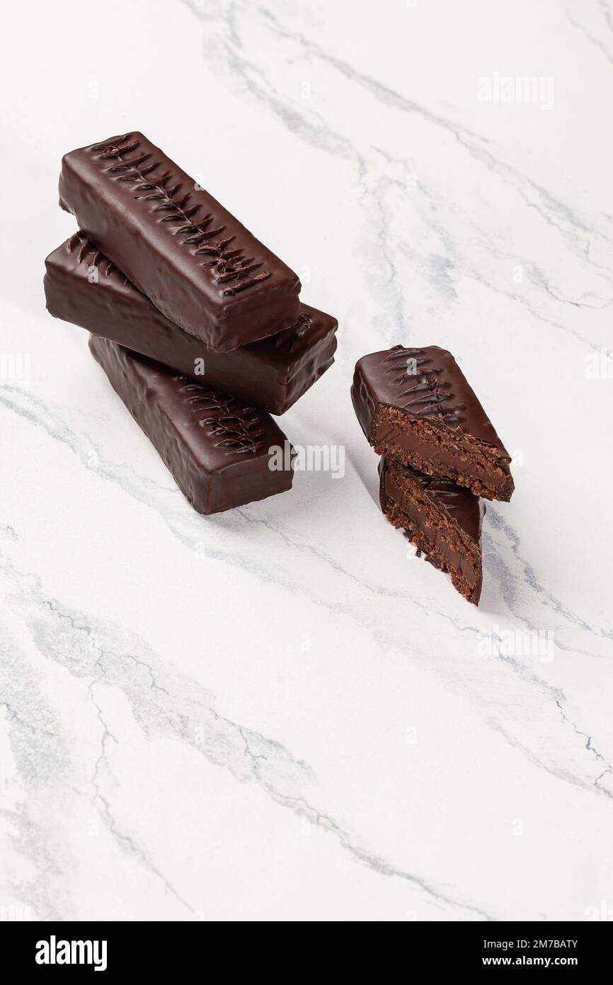 Dark chocolate bars with grounded dried fruits, honey and nuts Stock