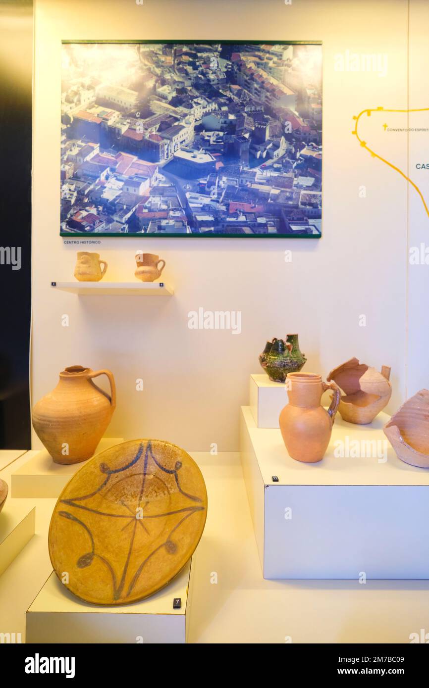 A display case in one of the gallery rooms, showing ancient pottery. At