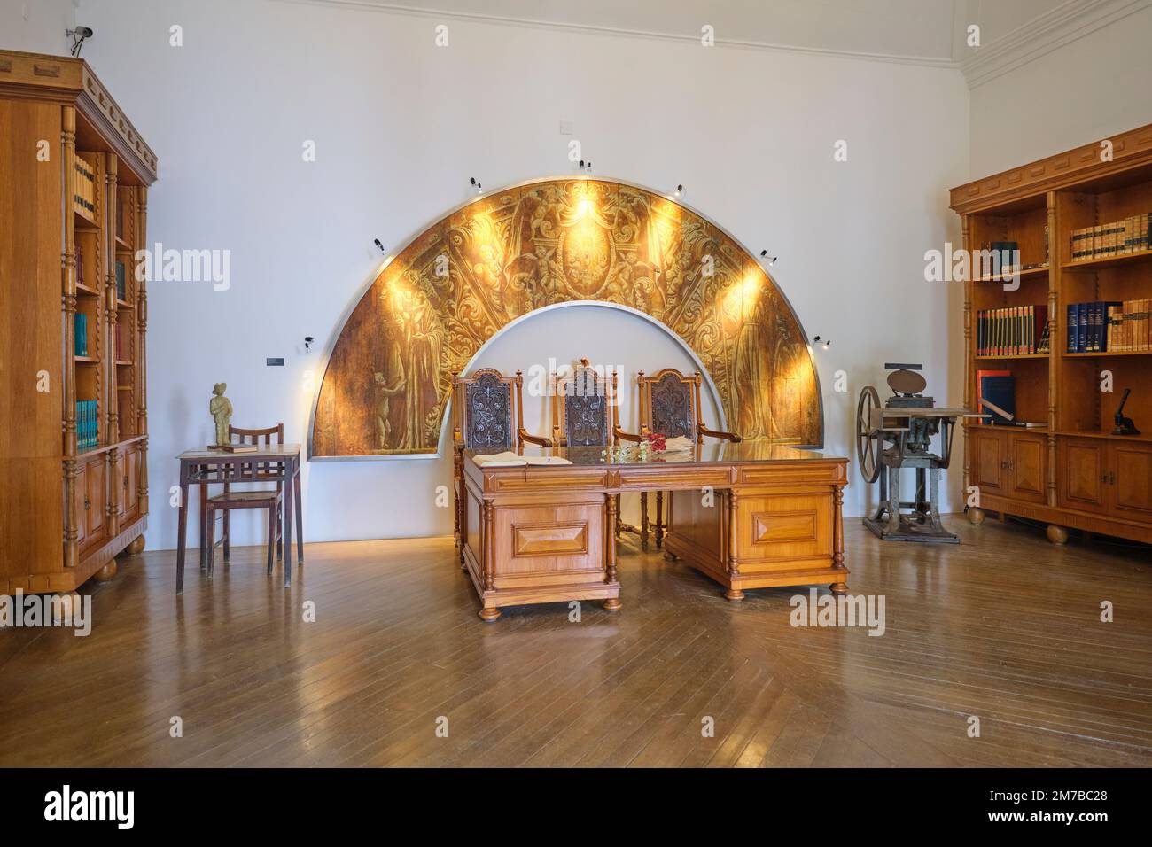 A grand, old, wooden government desk, part of the old furniture