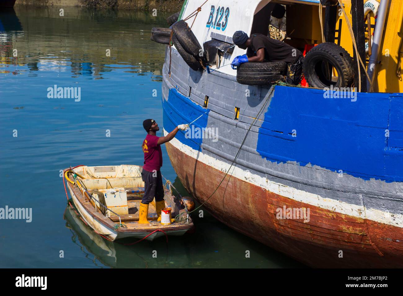 8 August 2019 An old working trawler undergoing routine painting and maintenance at the Quayside in Ardglass County Down Northern Ireland Stock Photo