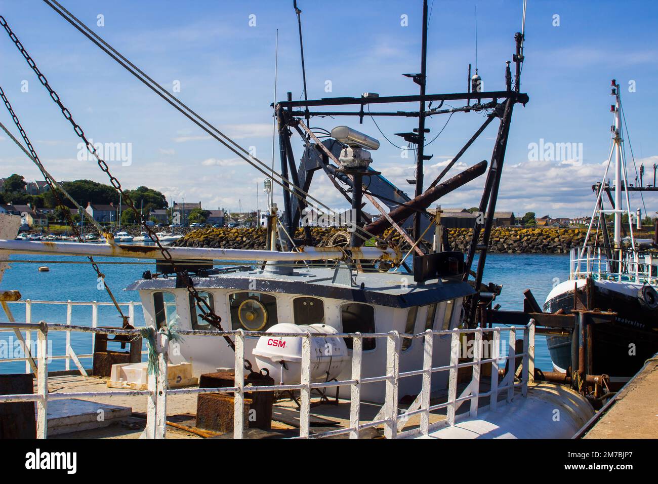 8 August 2019 ATrawler wheelhouse and fishing gantrys on a boat berthed at its home port in Ardglass Harbour County Down Northern Ireland Stock Photo