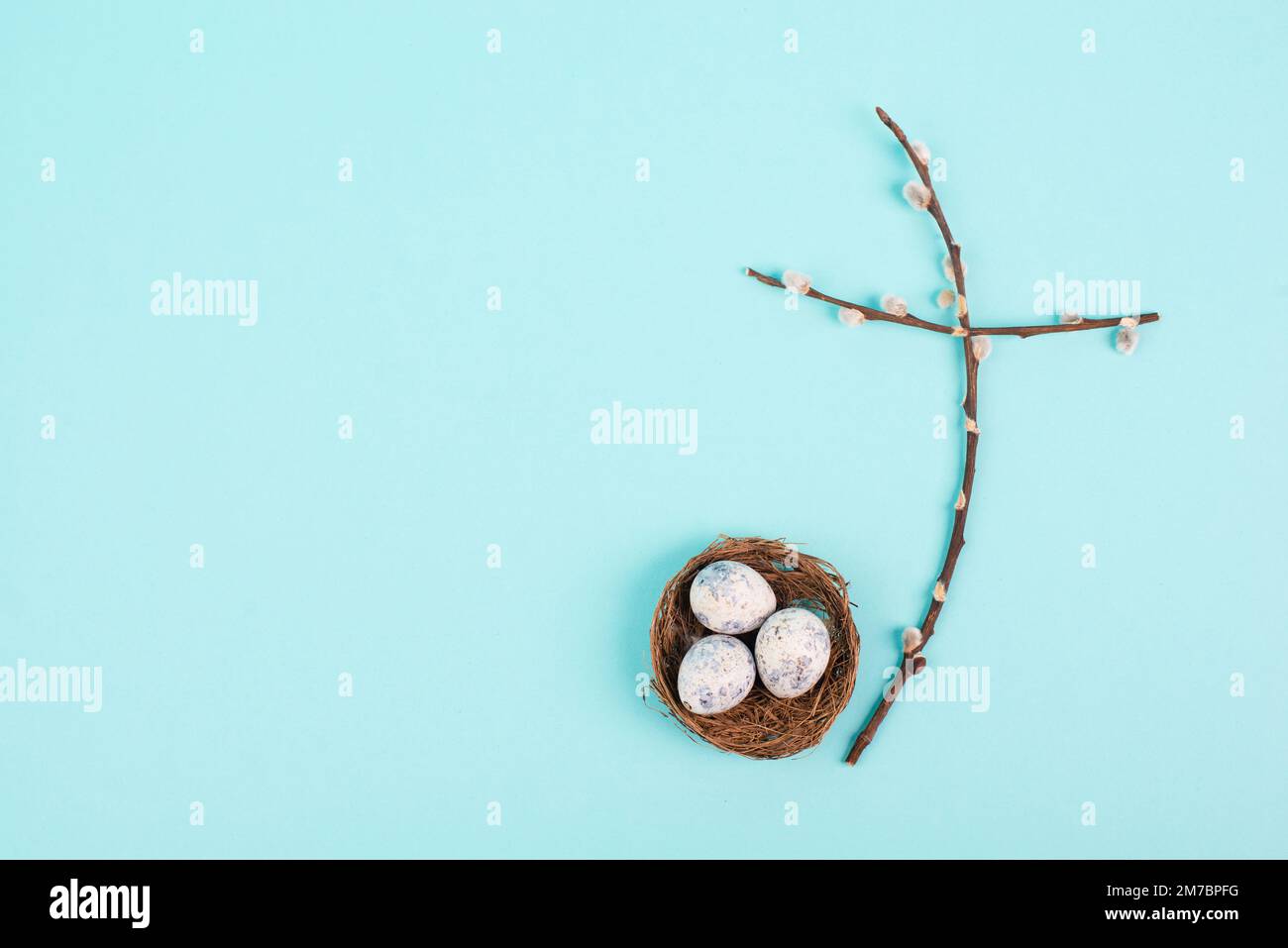 Religious cross made from willow branches, easter nest with eggs, belief, faith and spirituality in religon, resurrection of Jesus Christ, christianit Stock Photo