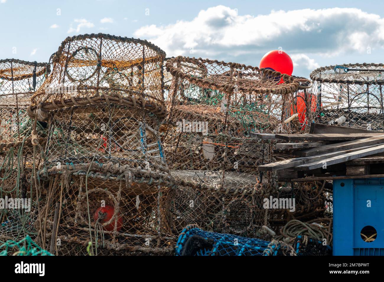 A stack of lobster and crab pots in Torquay Harbour, Devon, UK Stock