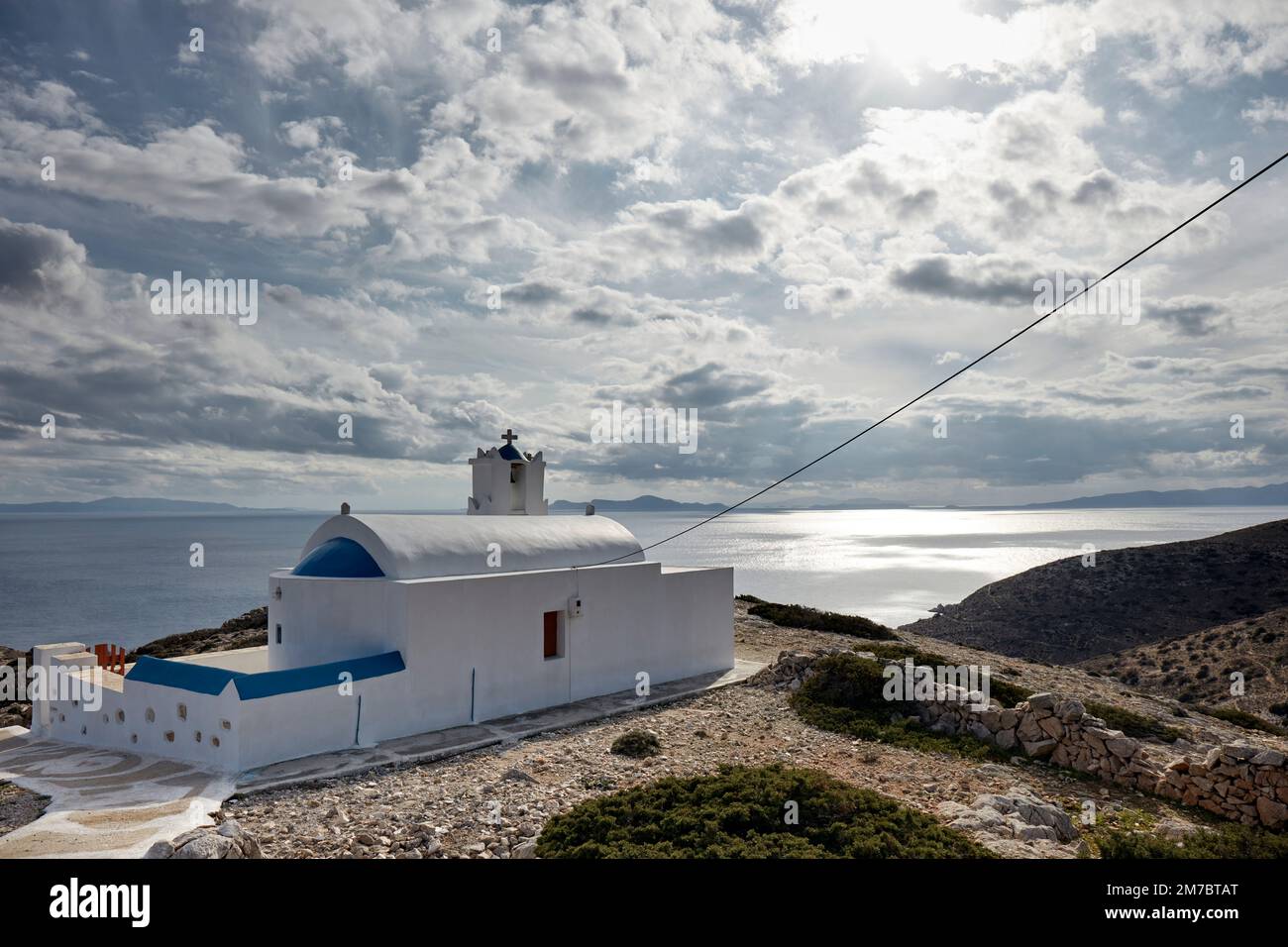 Cycladic church overlooking the aegean sea Stock Photo