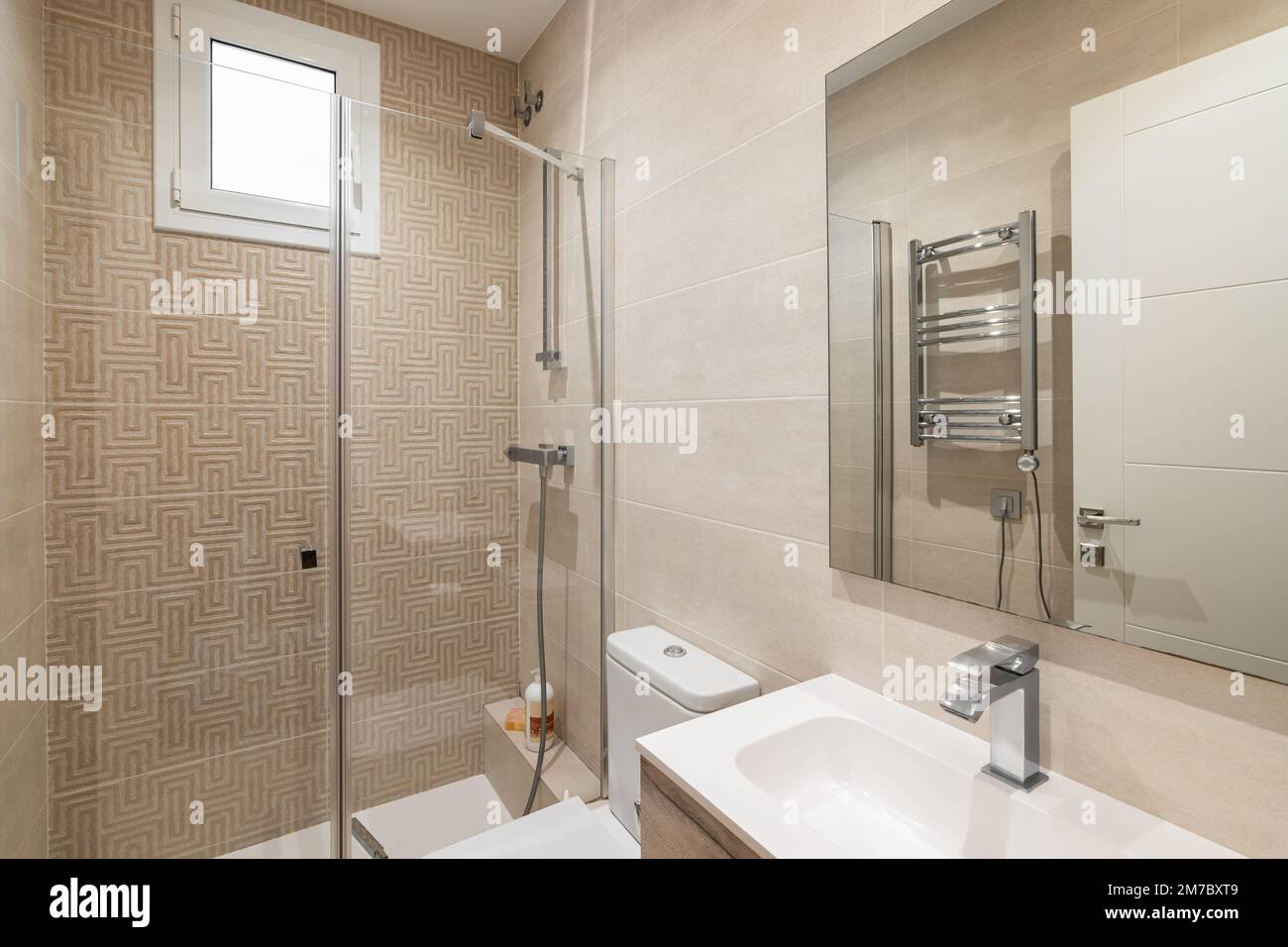 Bright bathroom in beige colors with glossy ceramic tile walls and ...