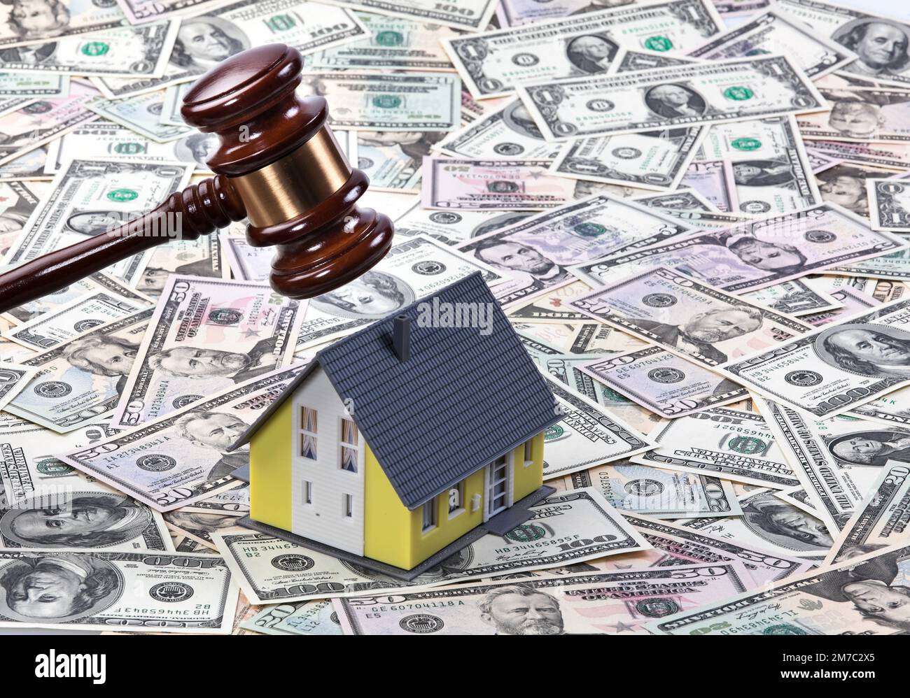 auction hammer/justice hammer with house and Dollar bills, real estate crisis, Japan Stock Photo