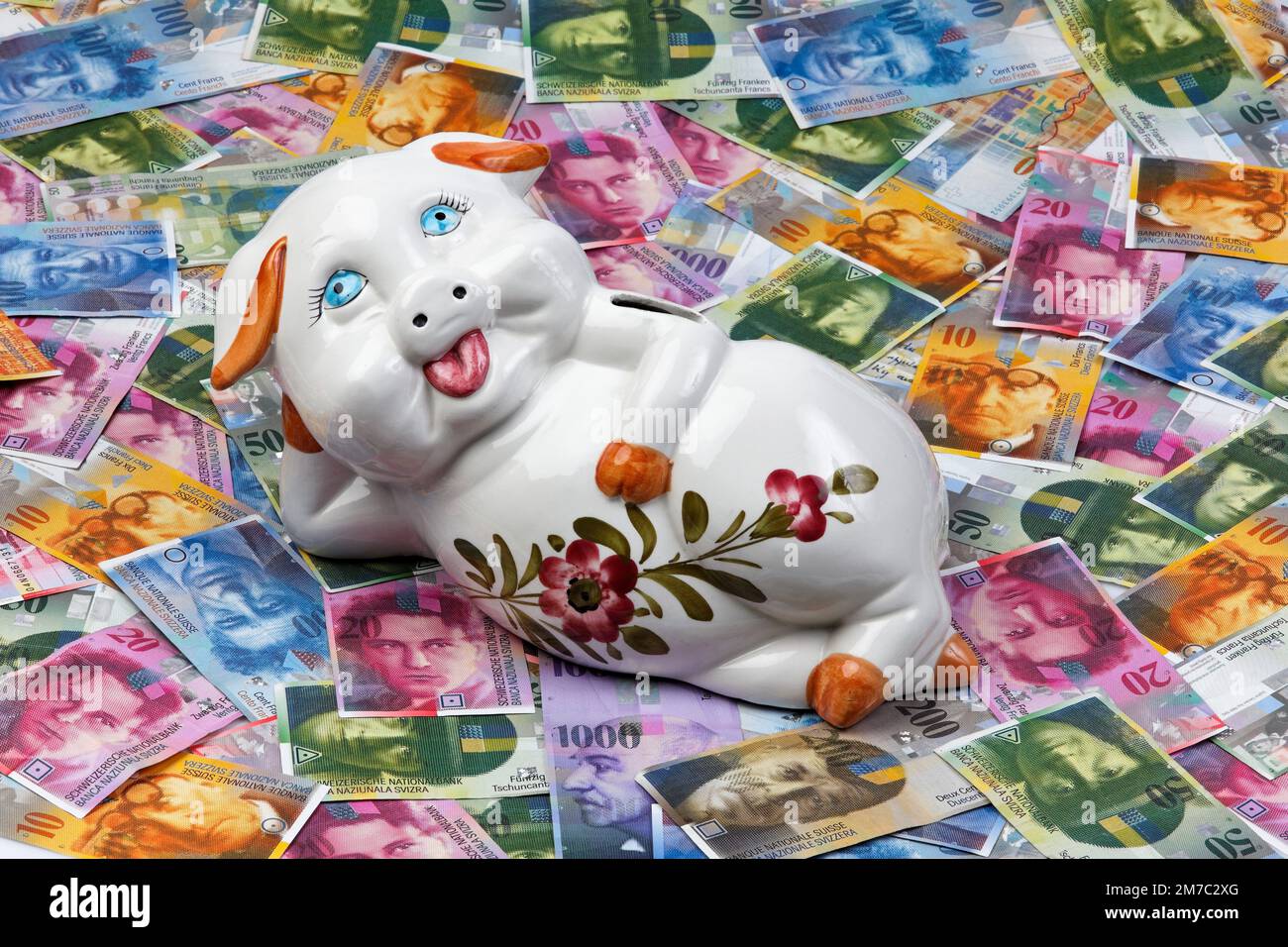 Suisse Francs with piggibank, Switzerland Stock Photo