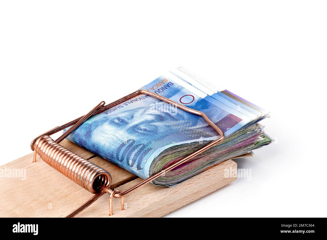 Swiss francs in a mousetrap, dept trap, Switzerland Stock Photo