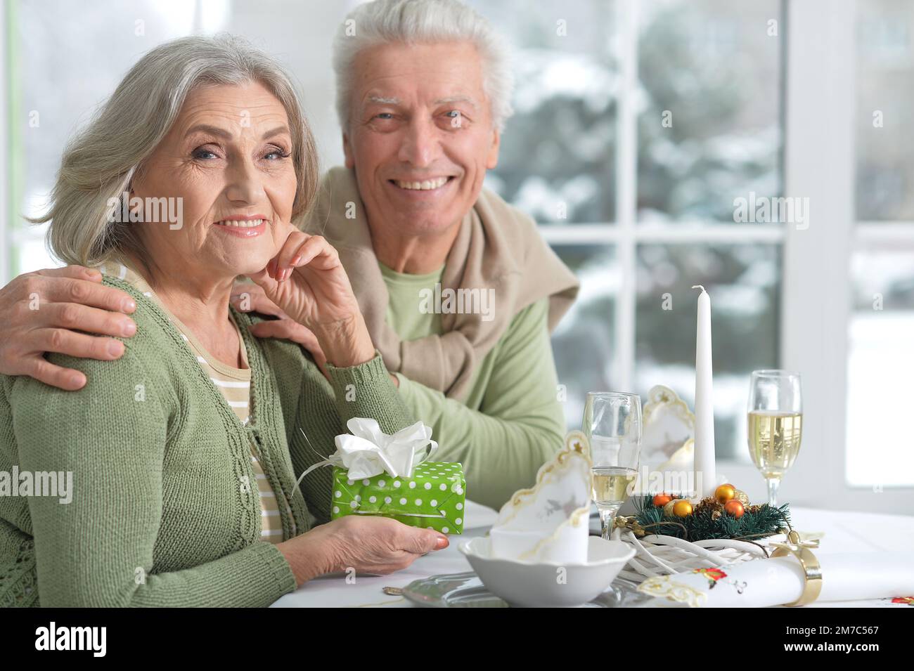 Beautiful elderly couple celebrating new year together  Stock Photo