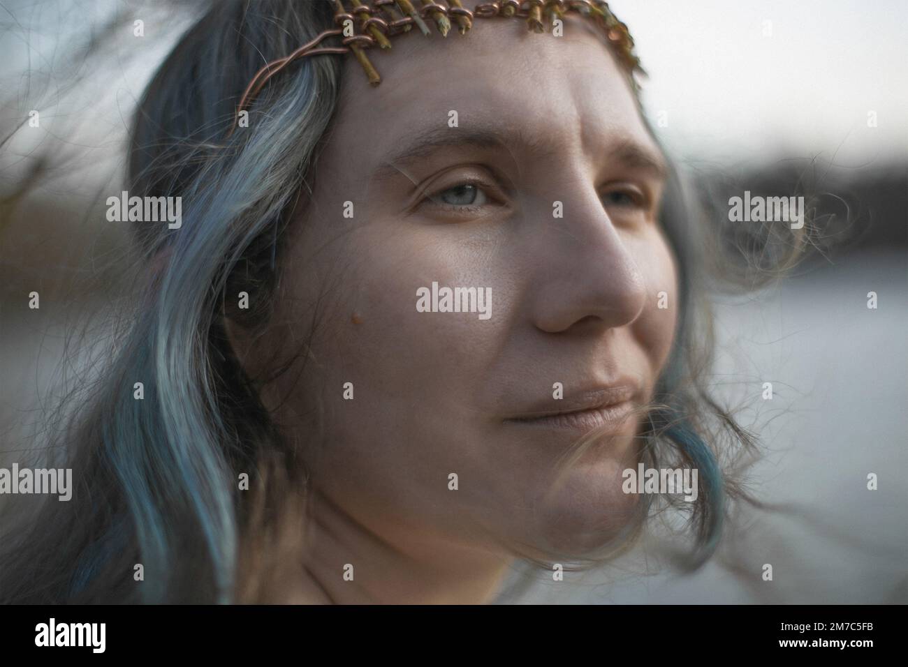 Close up authentic adult woman with gray hair and tender look portrait