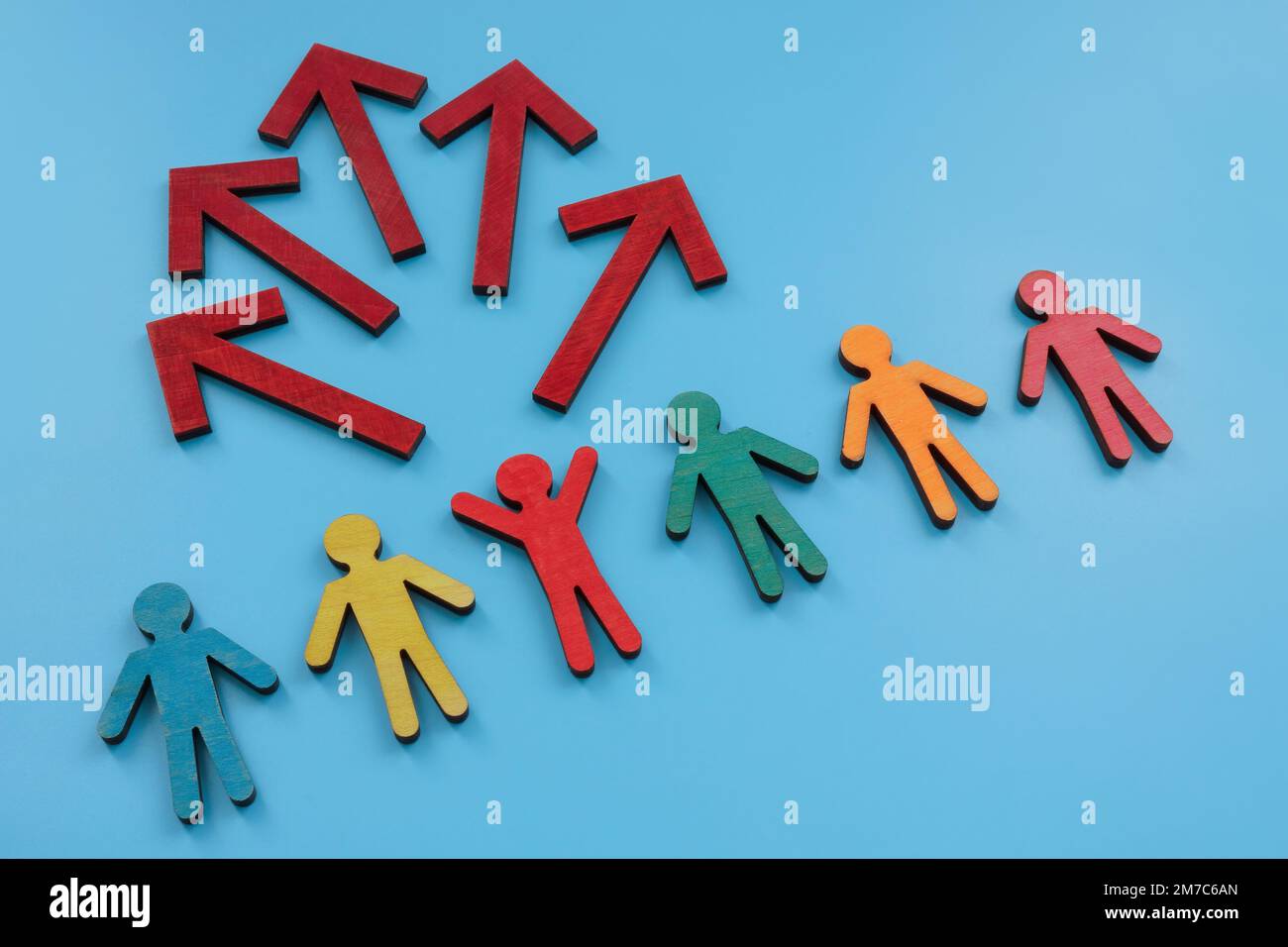 Colored figures and arrows from one as a concept of idea and creativity. Stock Photo