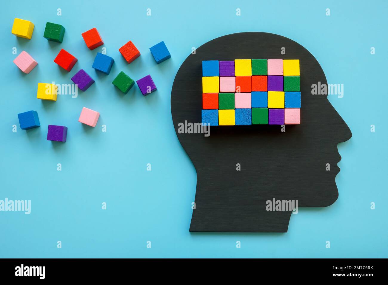 Head and colorful cubes on it. Positive thinking and creativity concept. Stock Photo