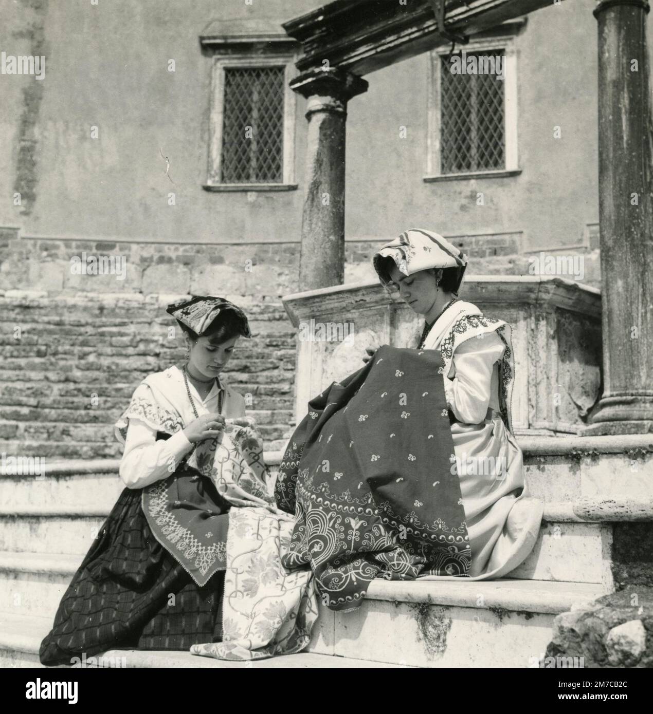 Women in traditional costume sewing outside, Palestrina, Italy 1960s