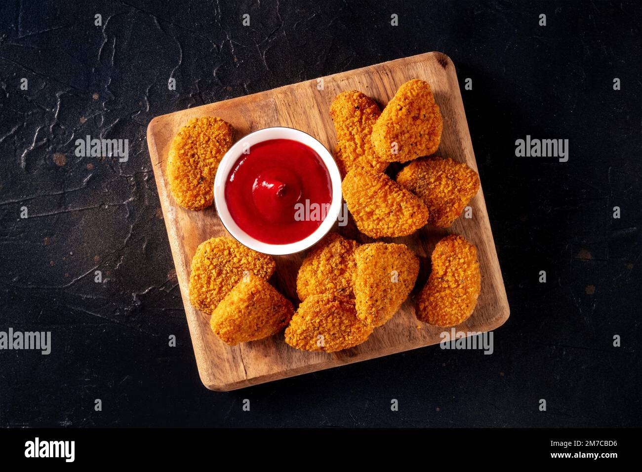 Chicken Nuggets With Ketchup On A Black Background Overhead Flat Lay