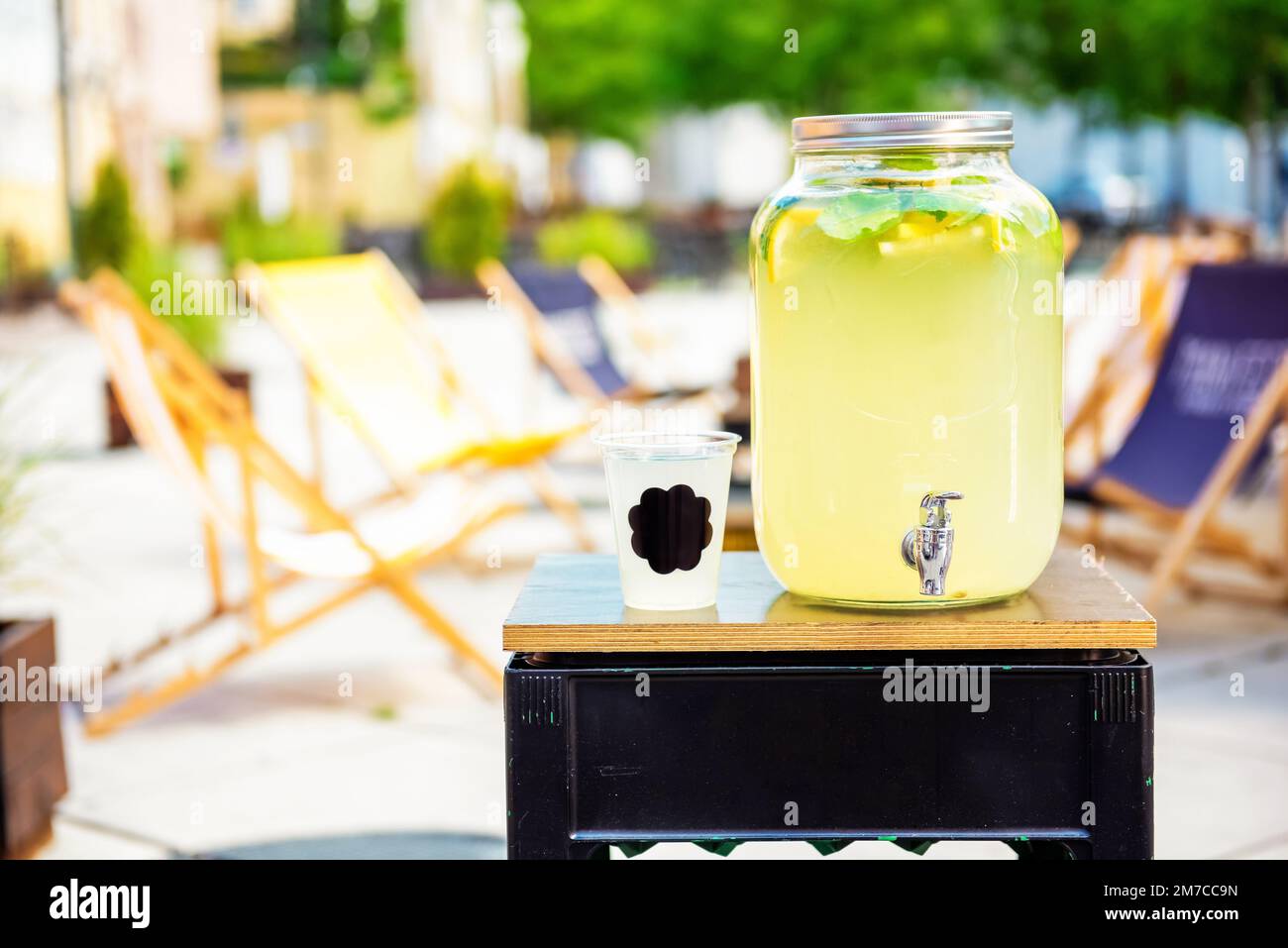fresh cold lemonade in a big jar, outdoor trading of refreshing drinks. food and drinks take away Stock Photo