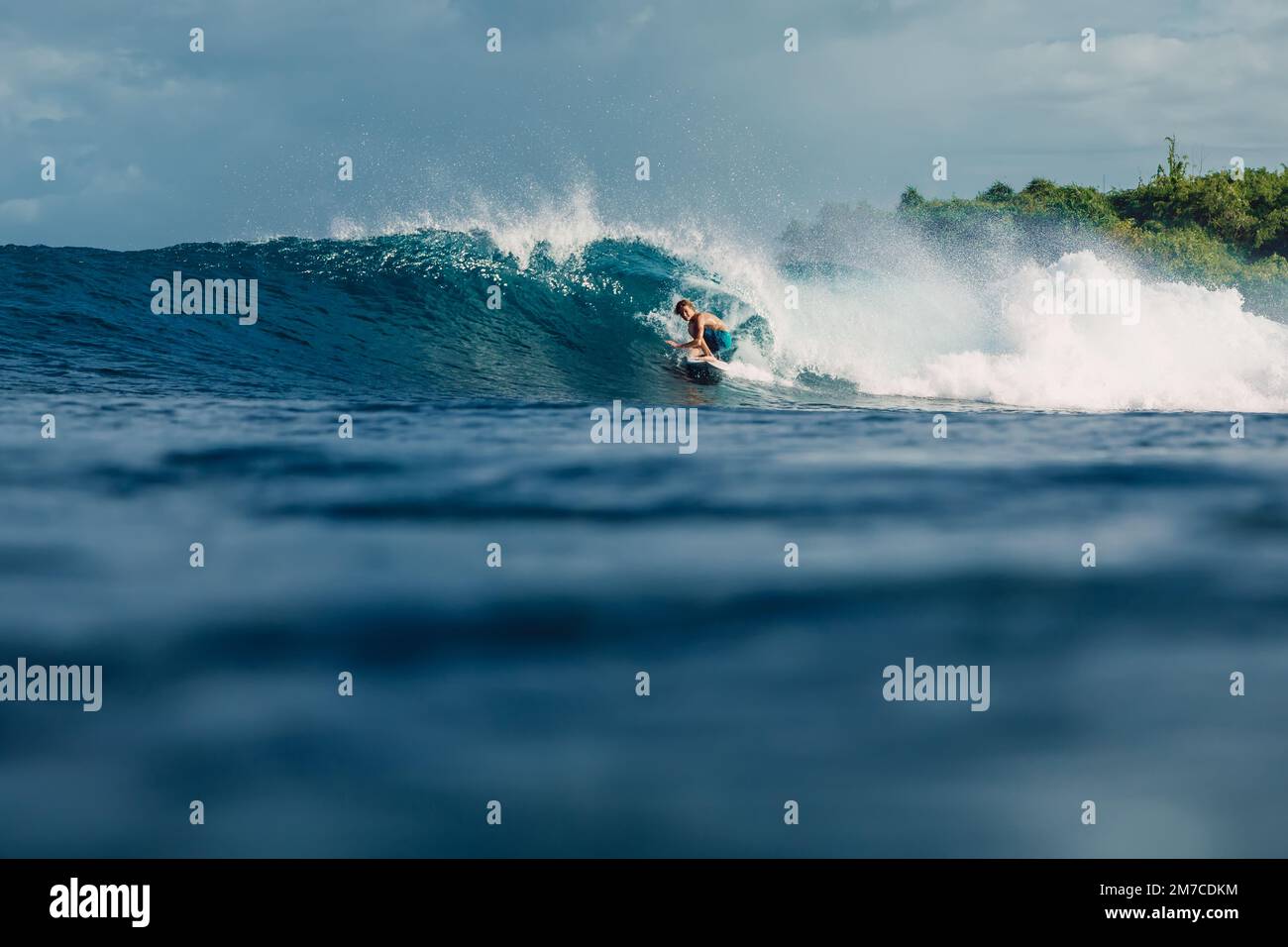 January 4, 2023. Bali, Indonesia. Teenager in tropical ocean during