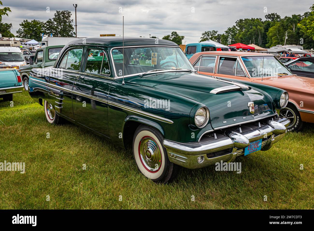Iola, WI - July 07, 2022: High perspective front corner view of a 1953 Mercury Monterey 4 Door Sedan at a local car show. Stock Photo