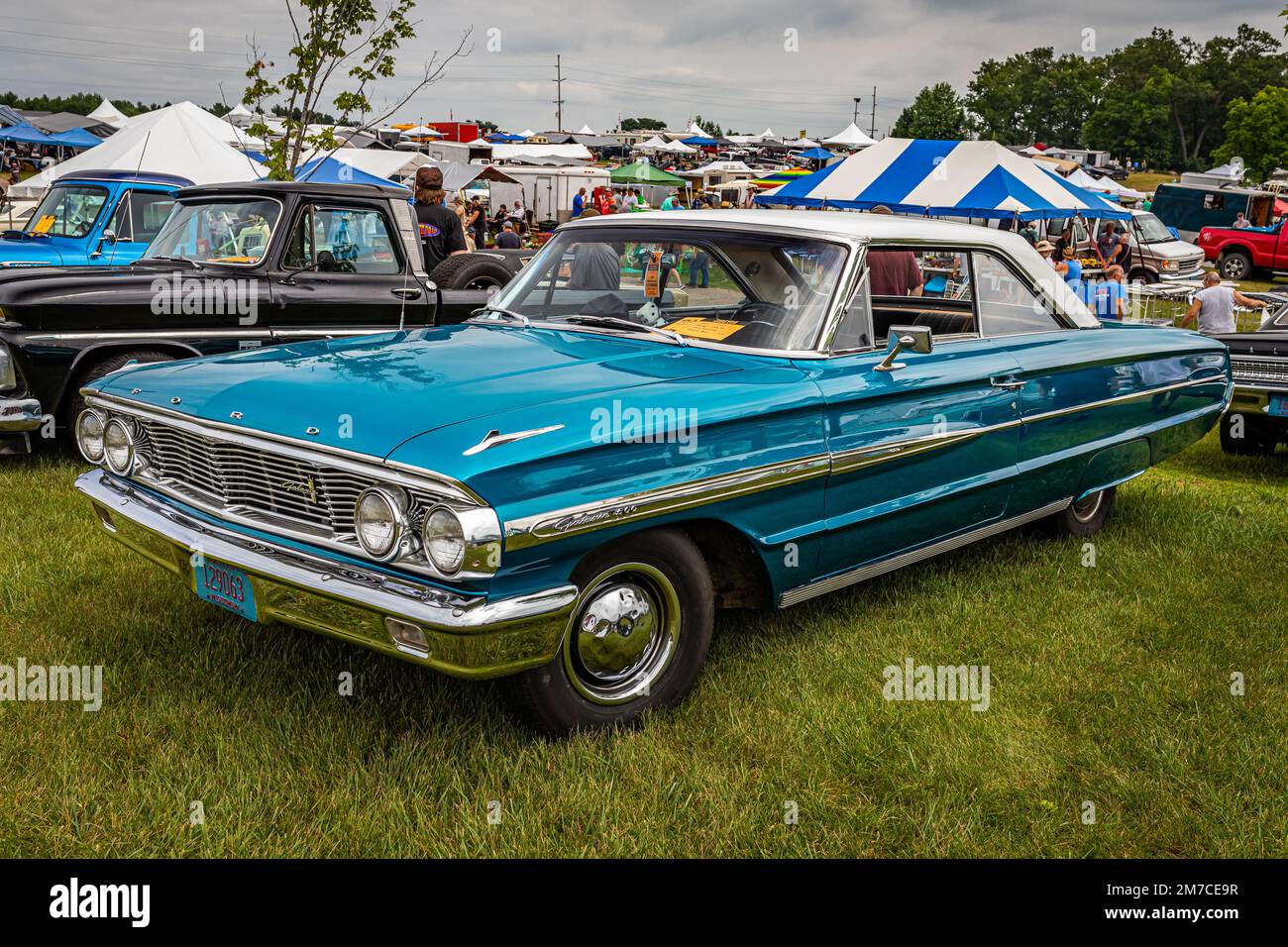 Iola, WI - July 07, 2022: High perspective front corner view of a 1964 Ford Galaxie 500 2 Door Hardtop at a local car show. Stock Photo