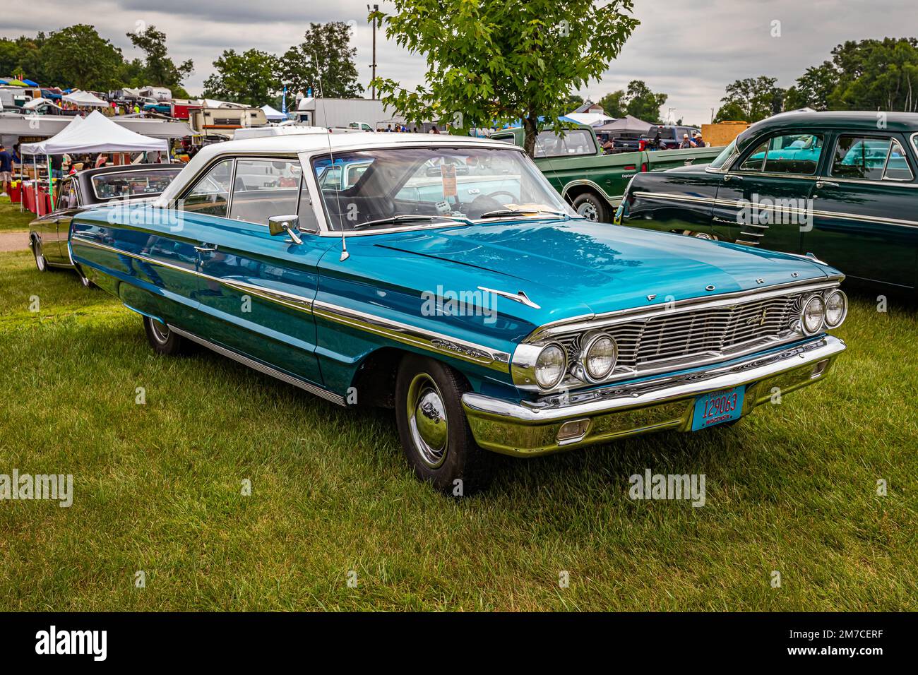 Iola, WI - July 07, 2022: High perspective front corner view of a 1964 Ford Galaxie 500 2 Door Hardtop at a local car show. Stock Photo