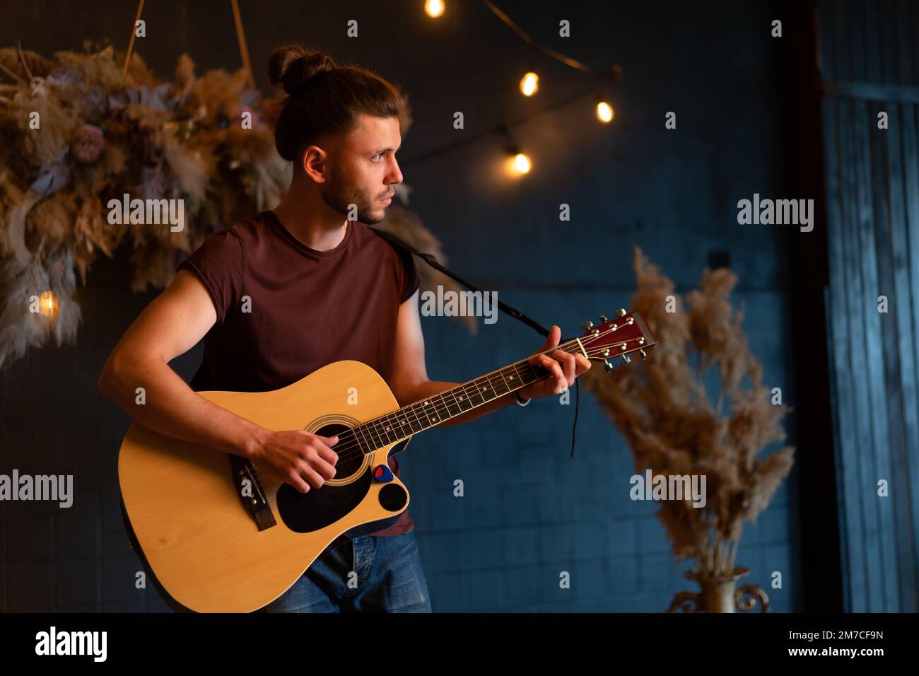 male-musician-playing-acoustic-guitar-guitarist-plays-classical-guitar