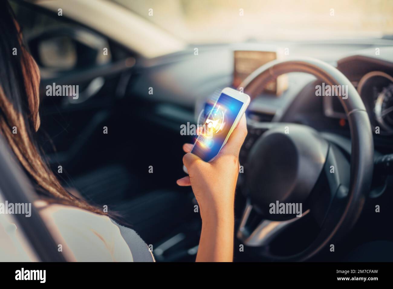 Young Woman use smartphone app calling for assistance after accident car insurance. hologram concept. Stock Photo
