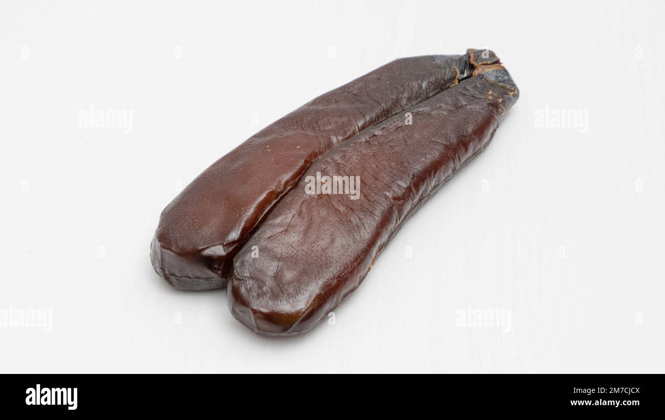 Bottarga, cured fish roe of grey mullet on white background Stock Photo