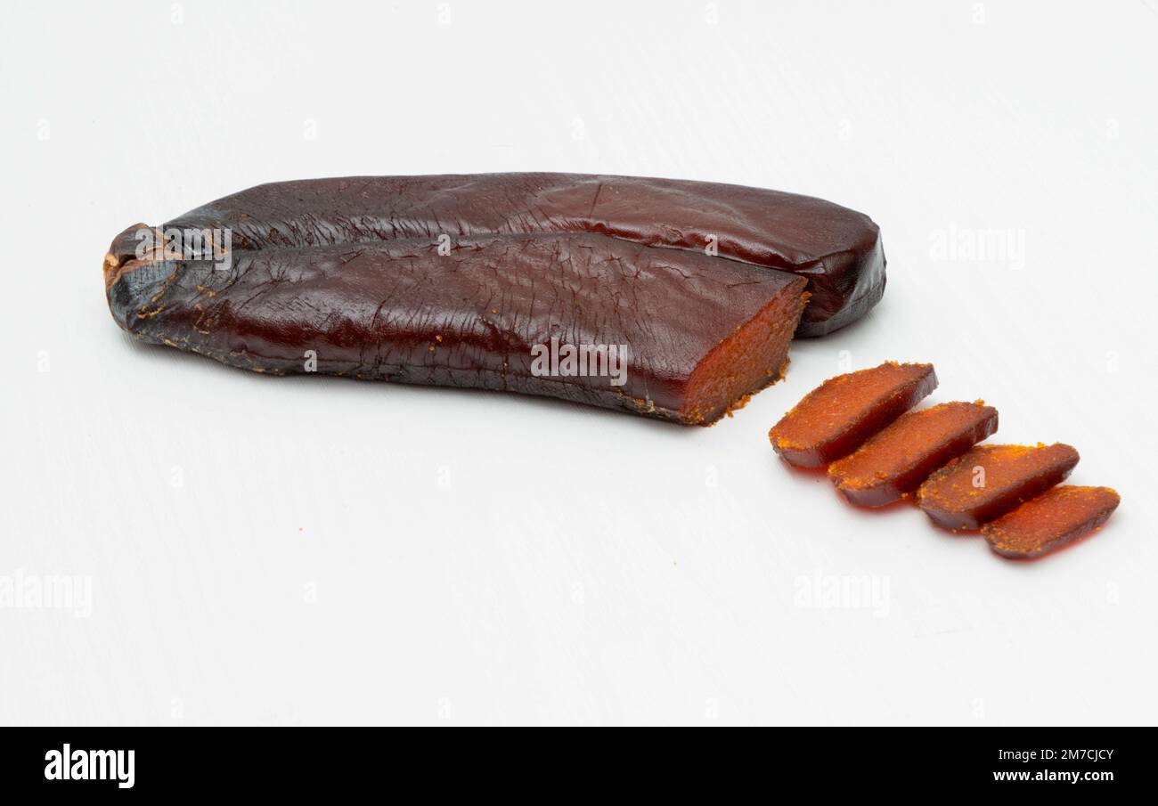 Bottarga, cured fish roe of grey mullet on white background Stock Photo