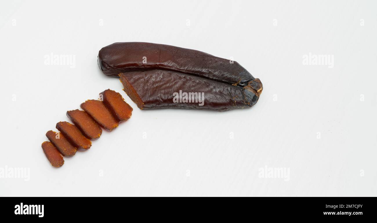 Bottarga, cured fish roe of grey mullet on white background Stock Photo