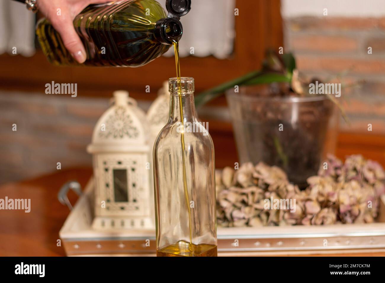 A stream of sparkling extra virgin olive oil, AOVE, as it pours from