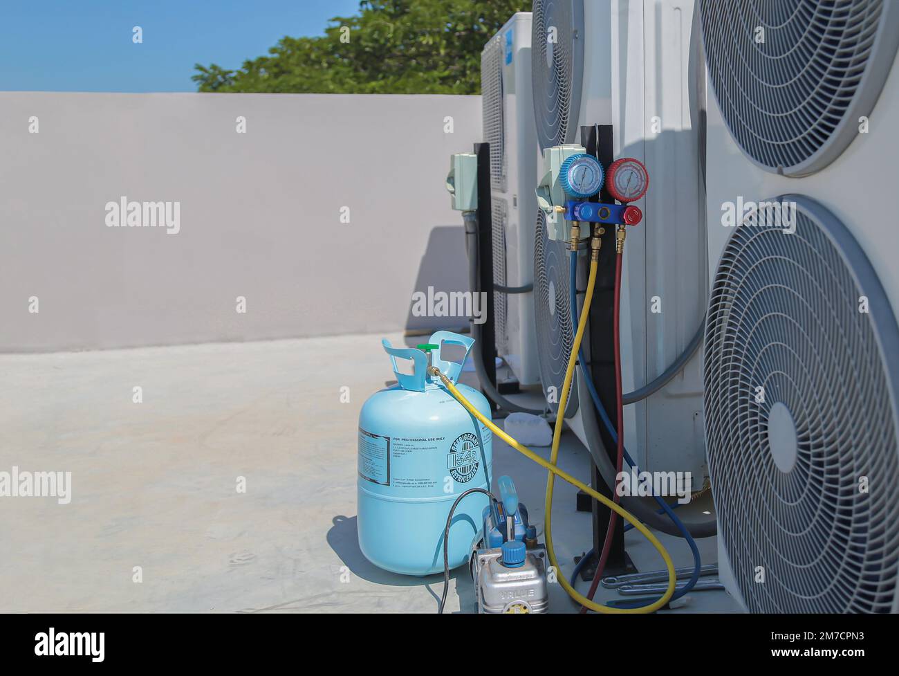 Air conditioner technician checking air conditioner operation Stock Photo Alamy