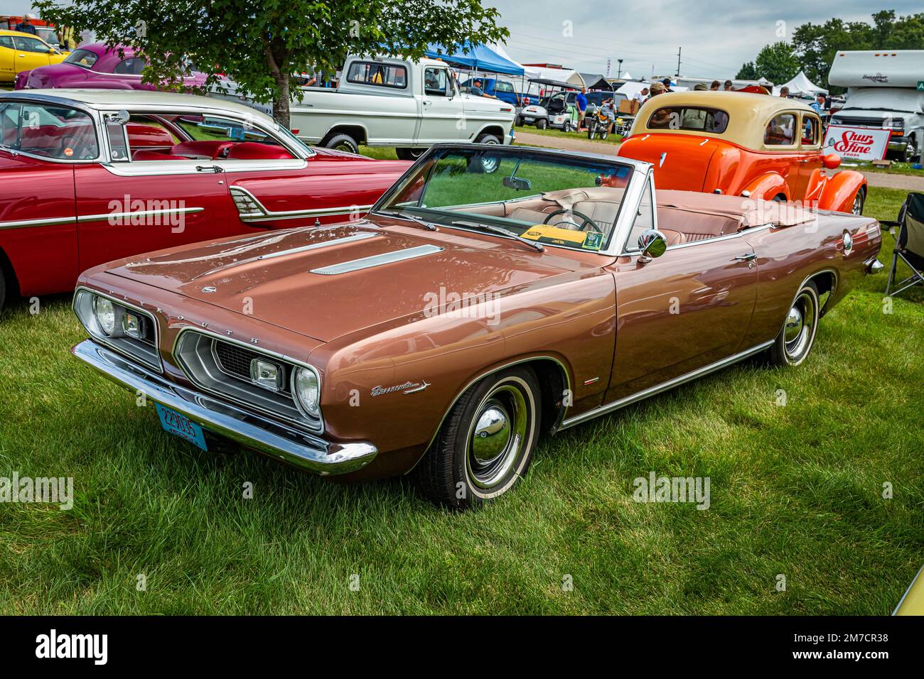 Iola, WI - July 07, 2022: High perspective front corner view of a 1967 Plymouth Barracuda Convertible at a local car show. Stock Photo
