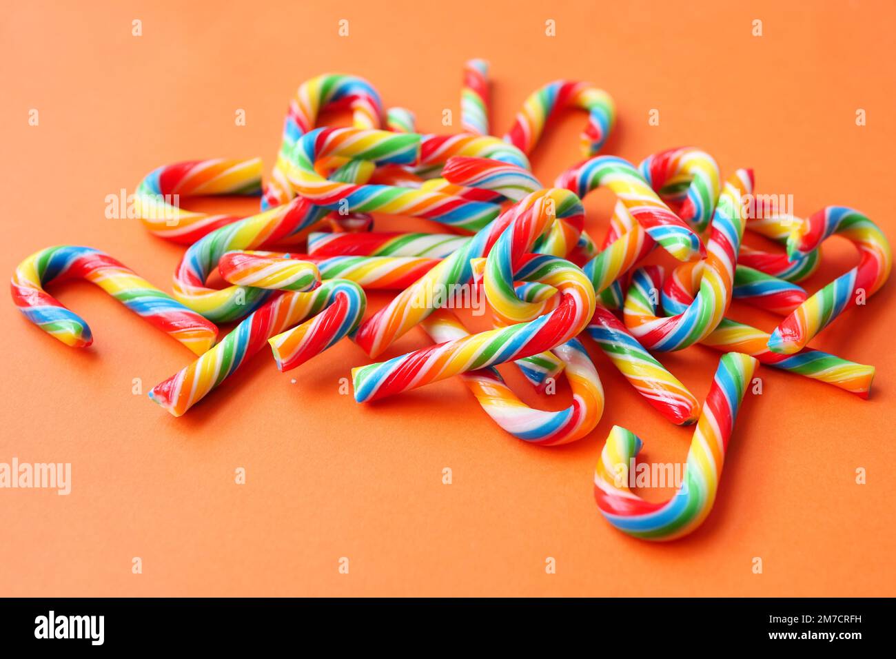 mini cherry candy canes on white background Stock Photo Alamy