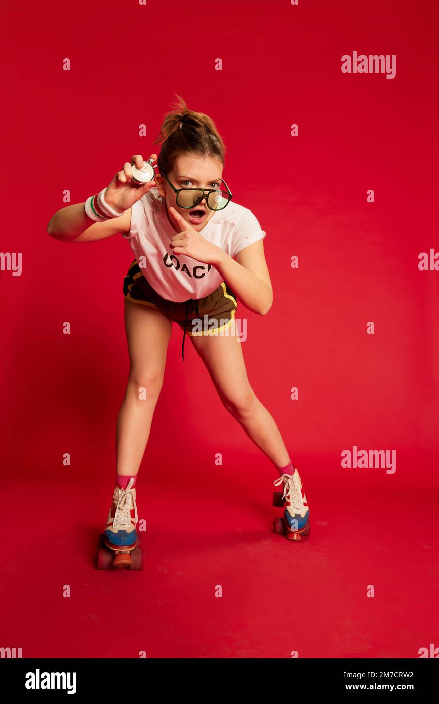 Workout. Dynamic portrait of fashionable stylish young girl in tshirt