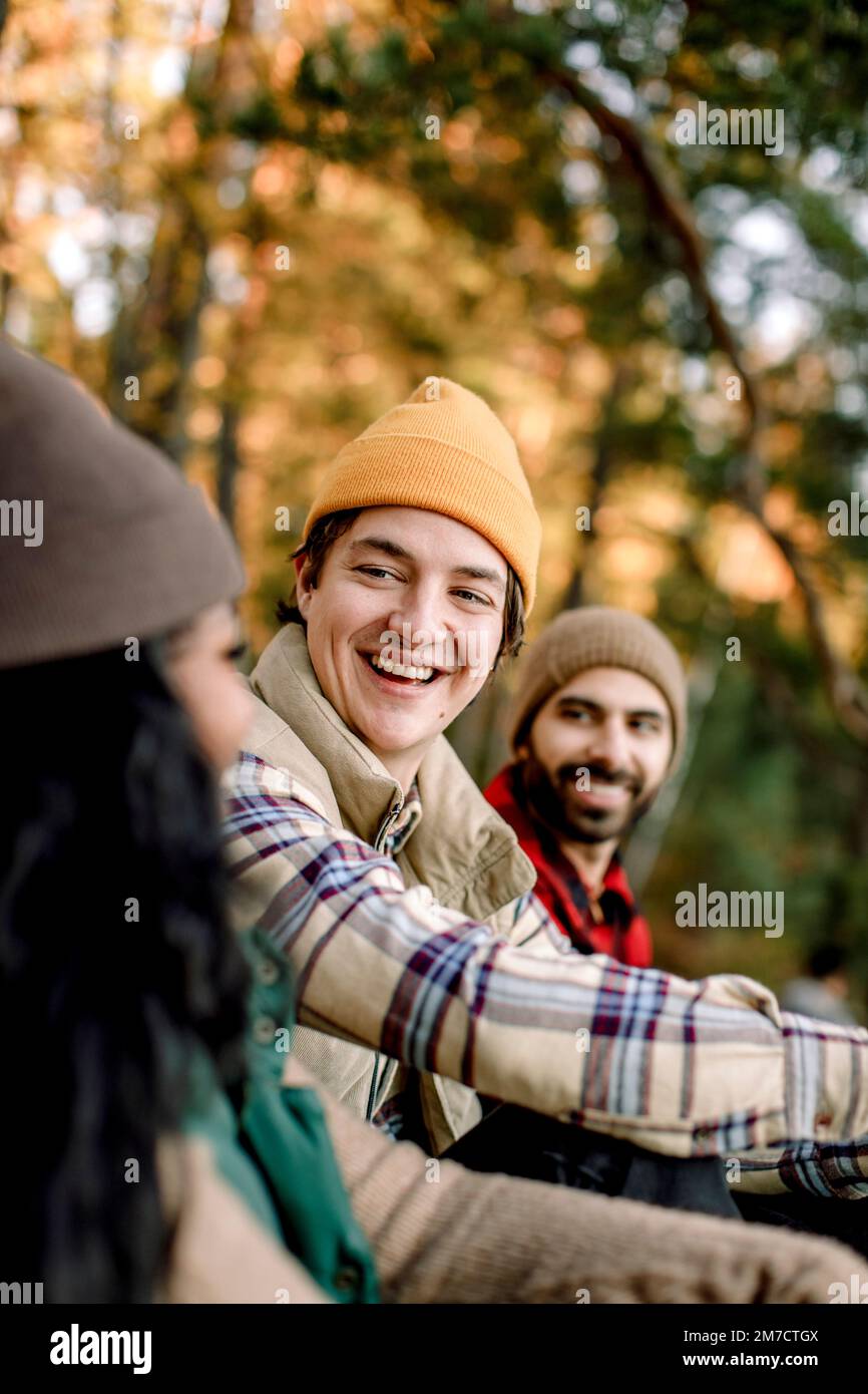 Happy man enjoying during camping with friends Stock Photo