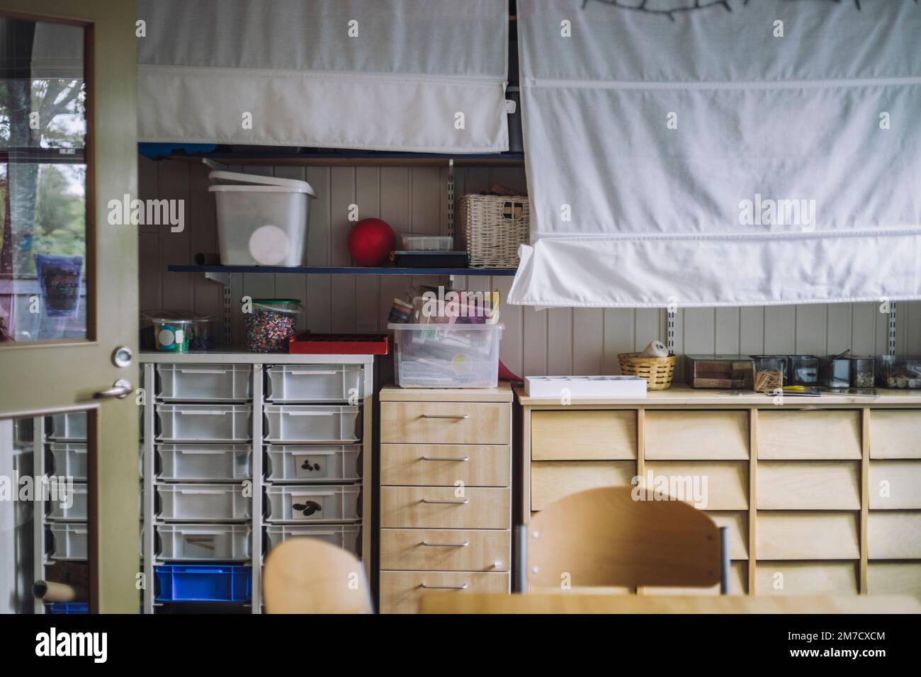 Storage compartments in child care center Stock Photo Alamy
