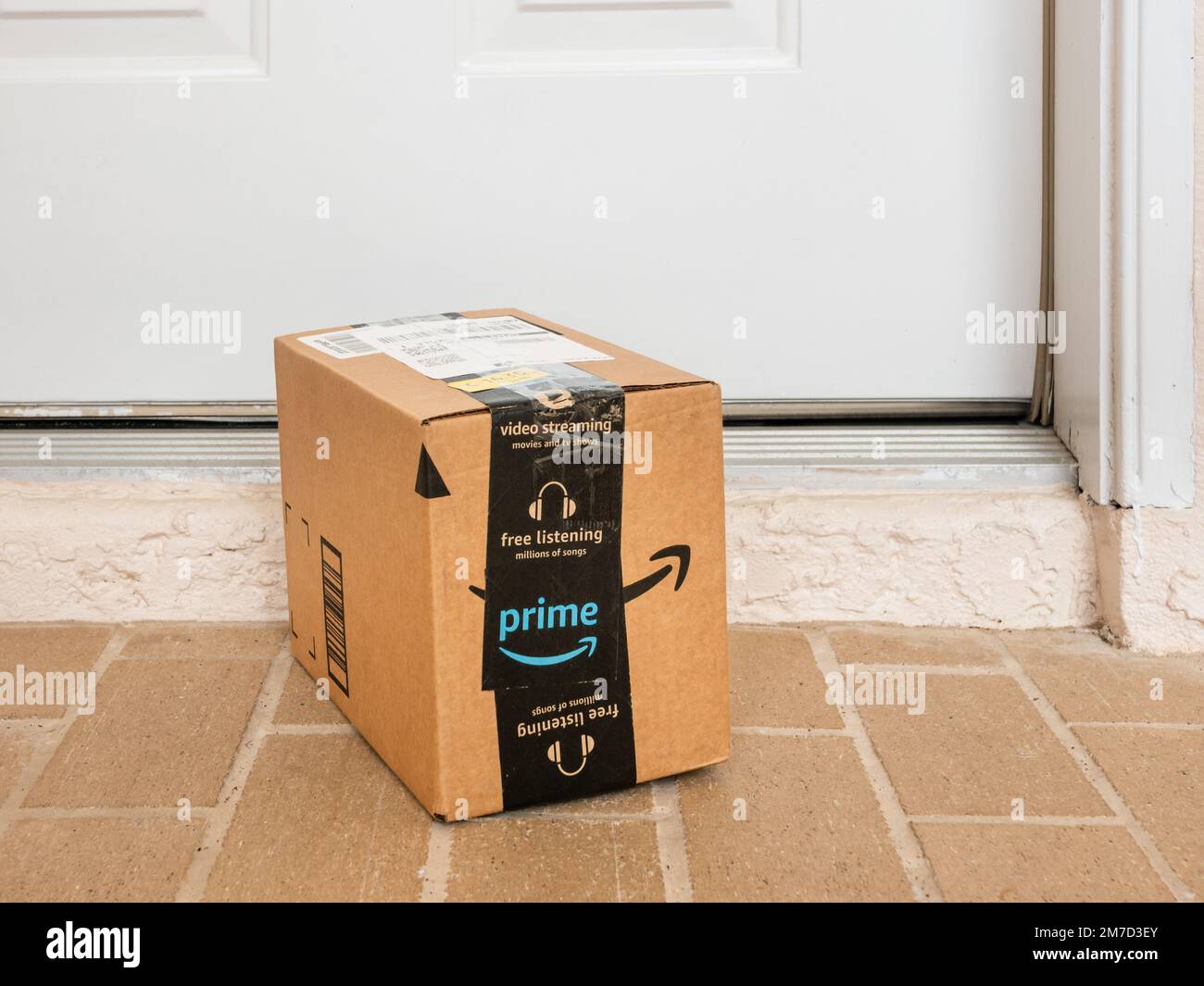Amazon prime box delivered to residential porch. Amazon offers free package delivery to it's prime members. Stock Photo